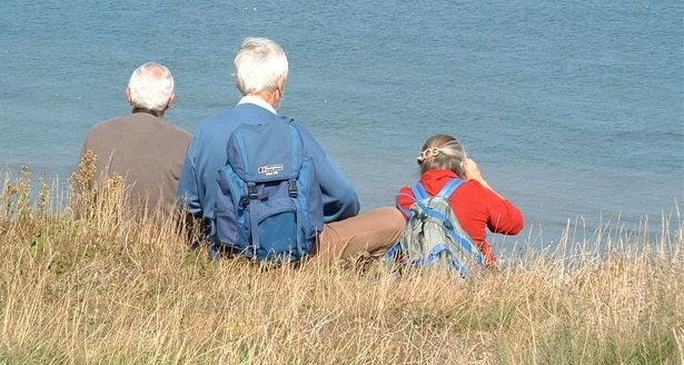 birders overlooking sea